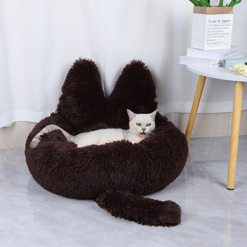 cat lying in cozy comfy brown cat bed