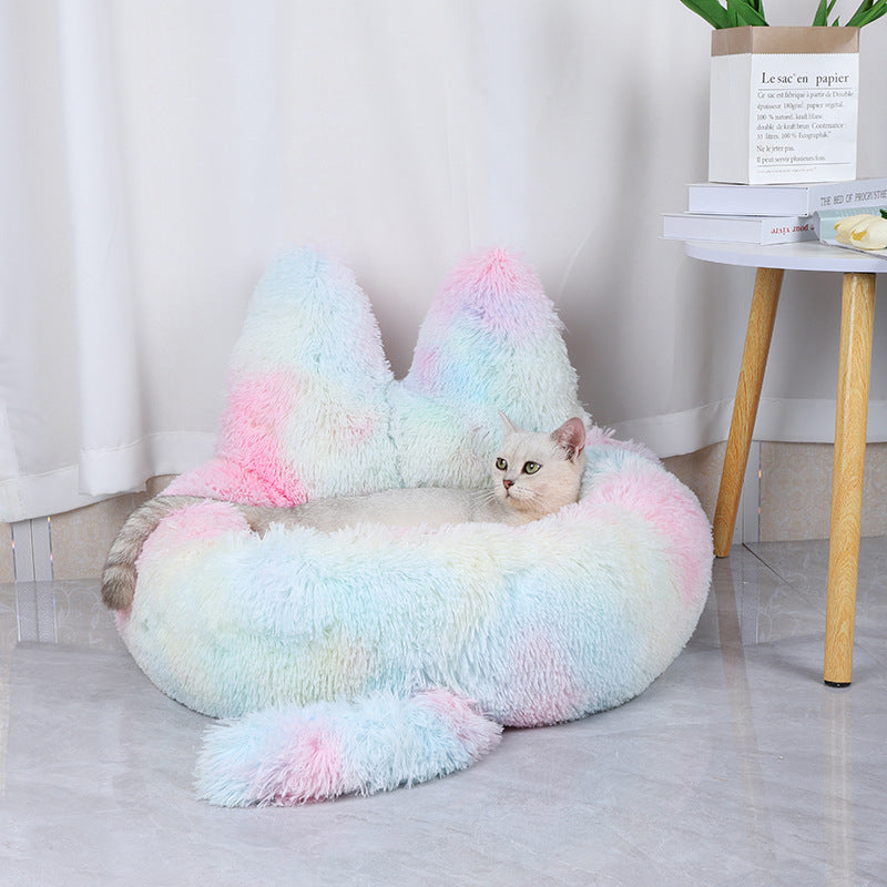Cat lying in cozy multi-colored cat bed 