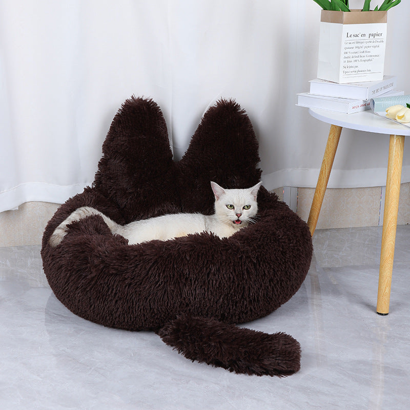 cat lying in cozy comfy brown cat bed 
