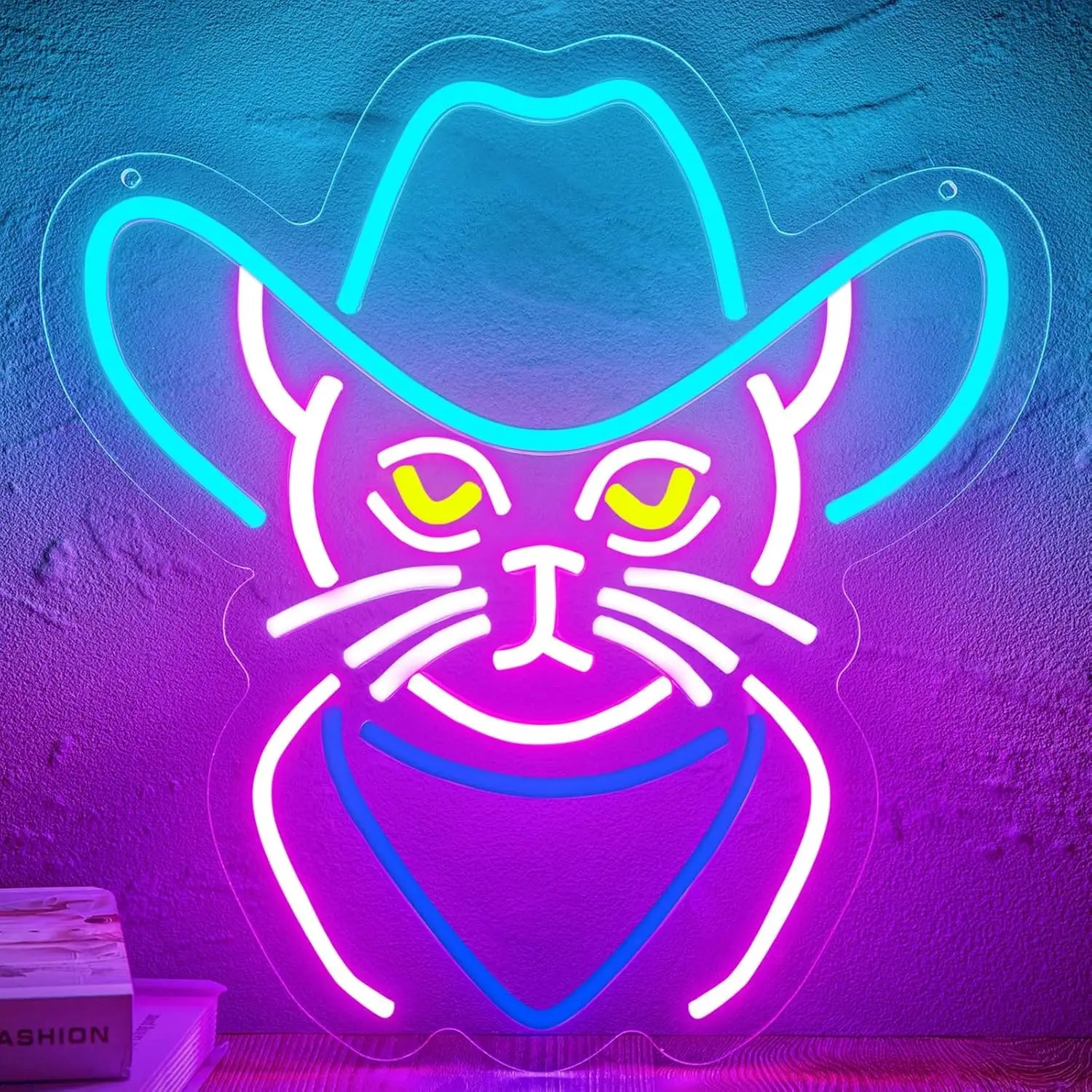 A neon sign of a cowboy cat with a hat and bandana, glowing in pink, blue, and yellow.