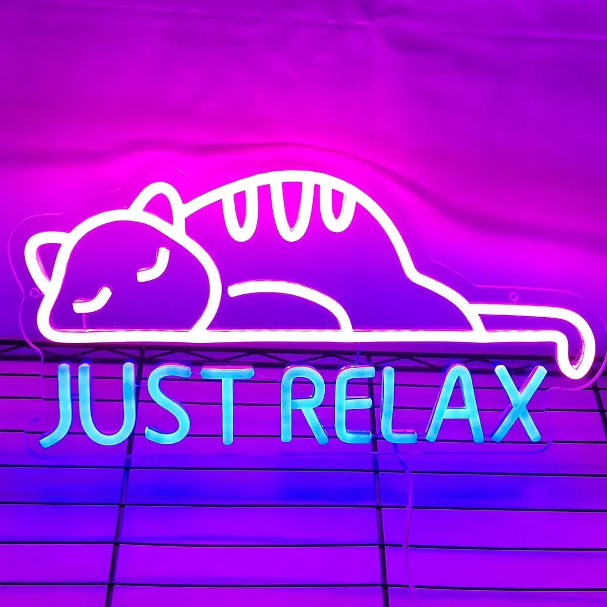 Purr-fect Snooze Neon Sign with a sleeping cat and 'Just Relax' text in vibrant pink and blue glow.