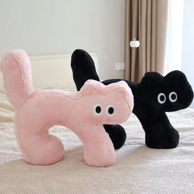 cat-shaped neck pillow in black and pink colors
